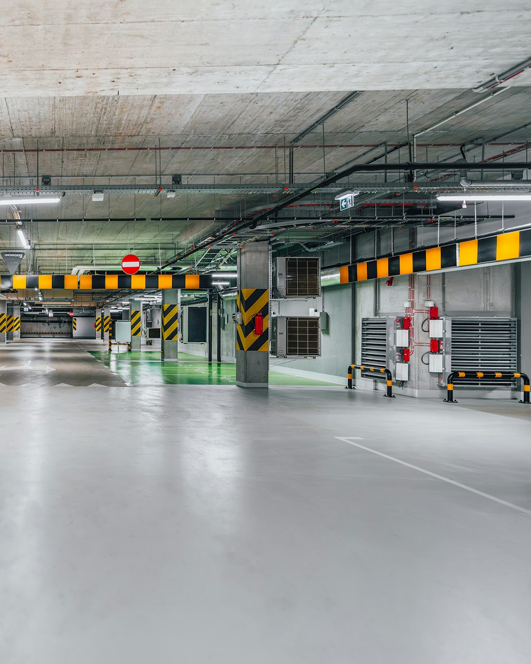 Bright, clean underground garage with marked bays
